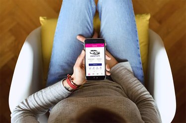 Image looking down on a female using the GO Rentals App to make a booking