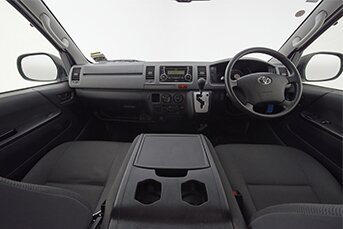 Interior image of the front of the Toyota Hiace 10-seater minibus taken from the rear seats
